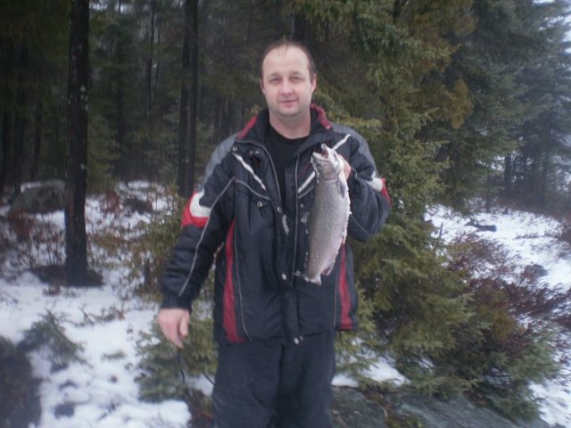 brook trout.jpg - Curt with an opening day Jan 1 2011 brook trout from Sudbury Ontario.